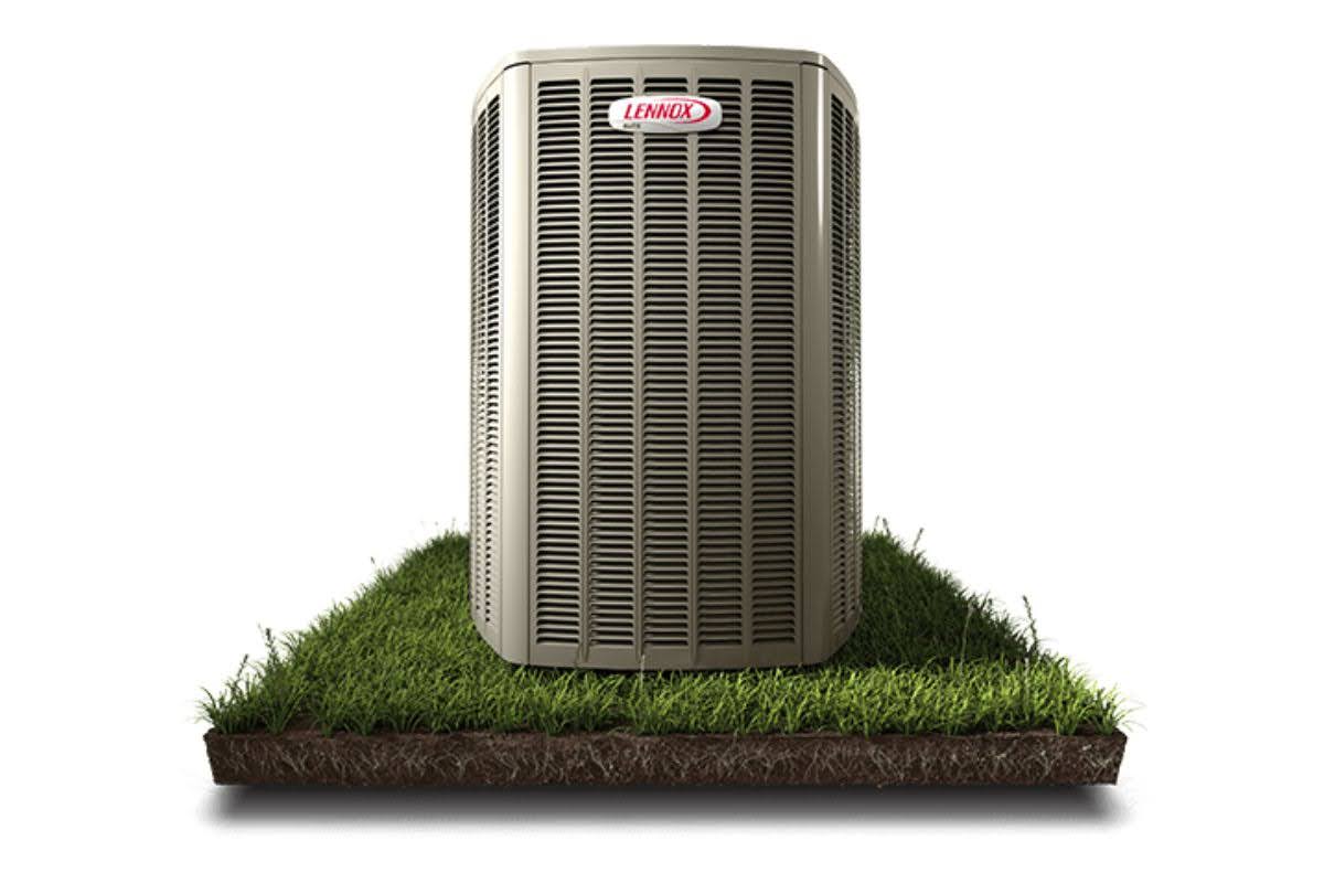 A high-quality heat pump from Lennox on the grass.