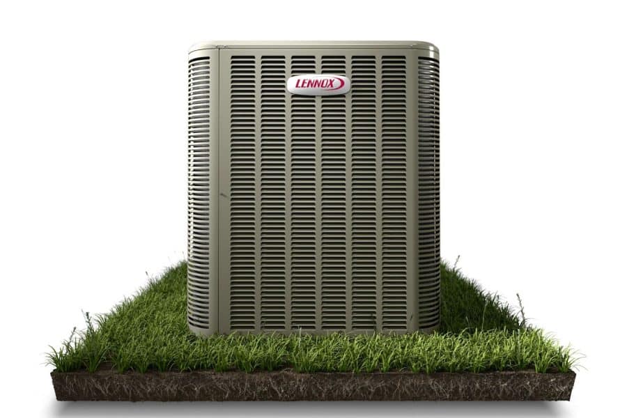 A Lennox AC unit on grass.